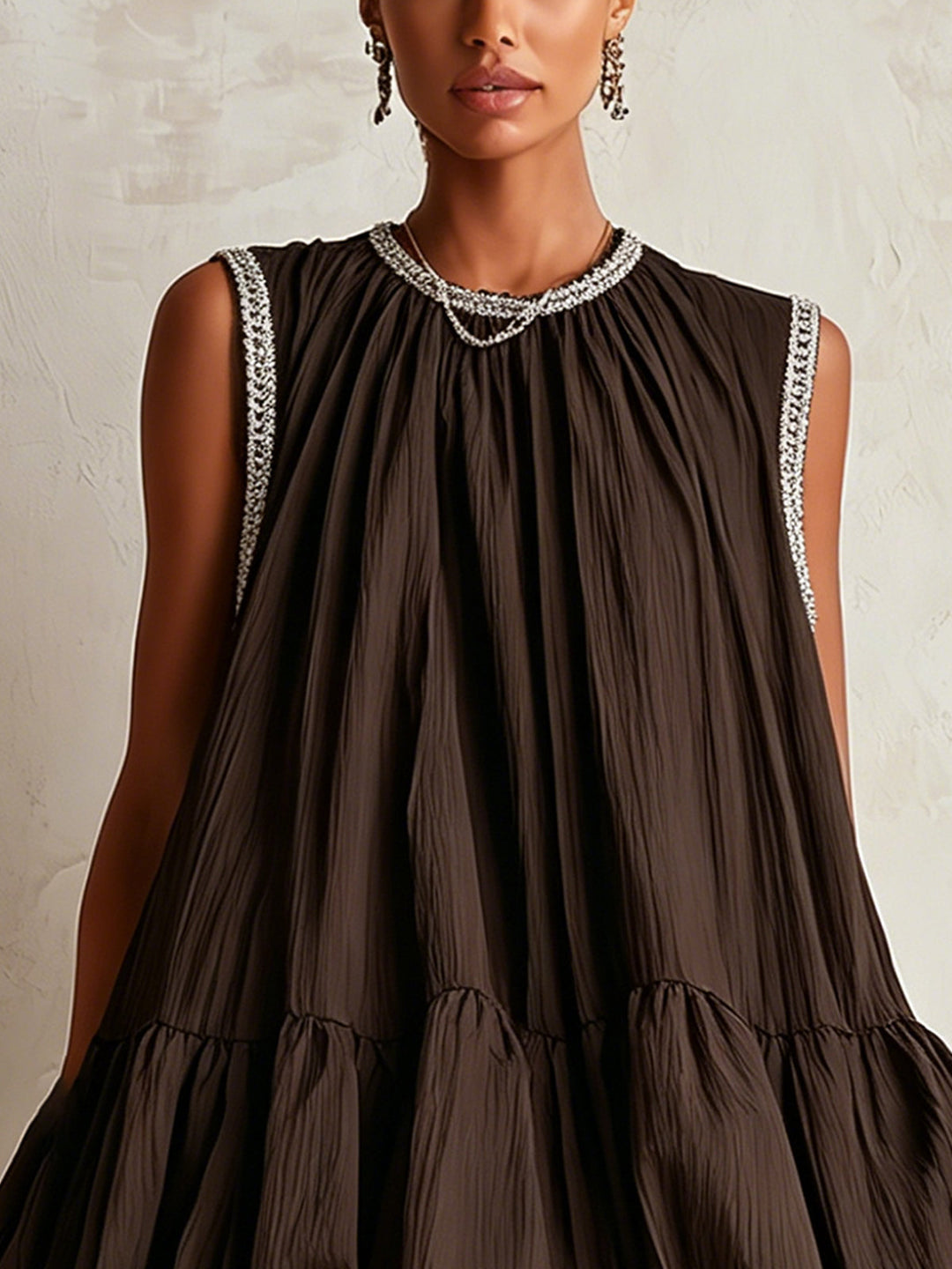 Brown sleeveless mini dress with a bubble hem