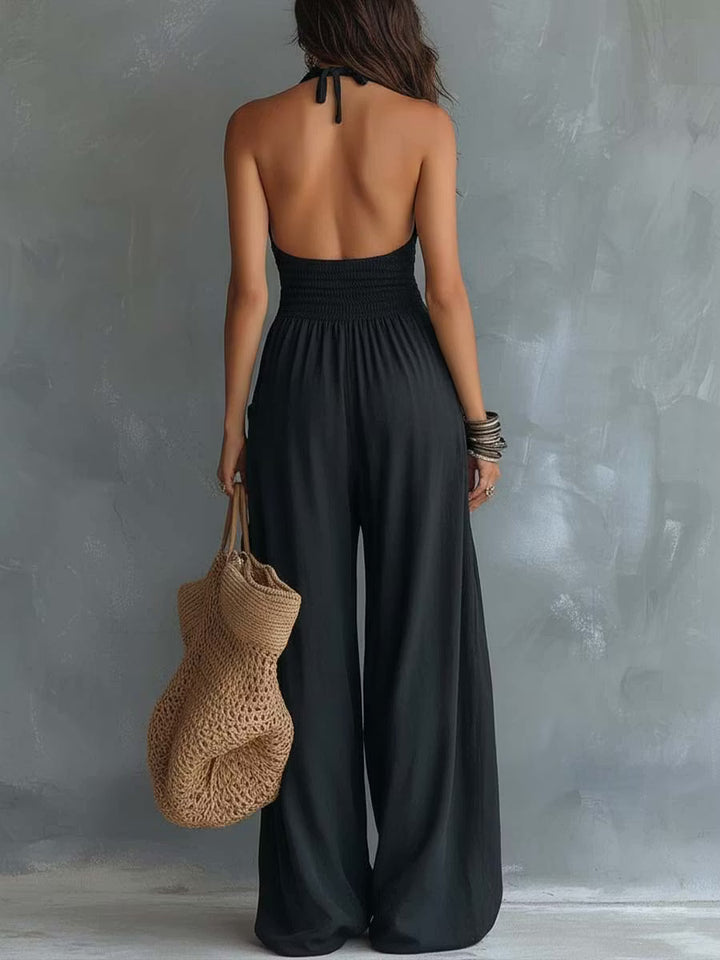 Retro cotton and linen jumpsuit with lace halter neck and pockets.