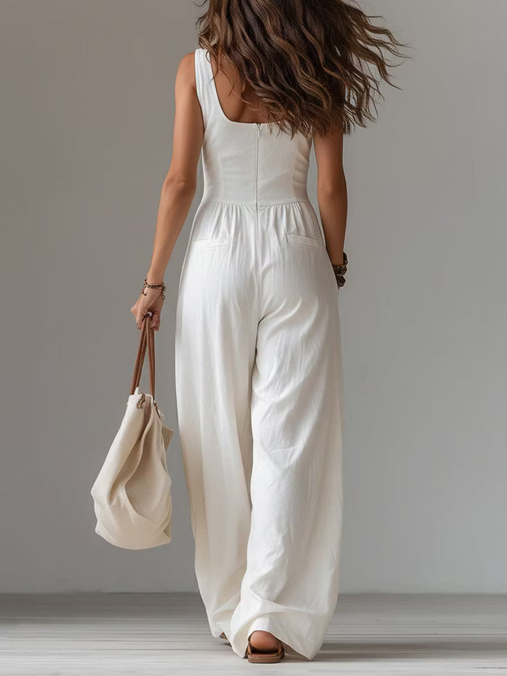 Casual sleeveless wide-leg jumpsuit with applied pockets.