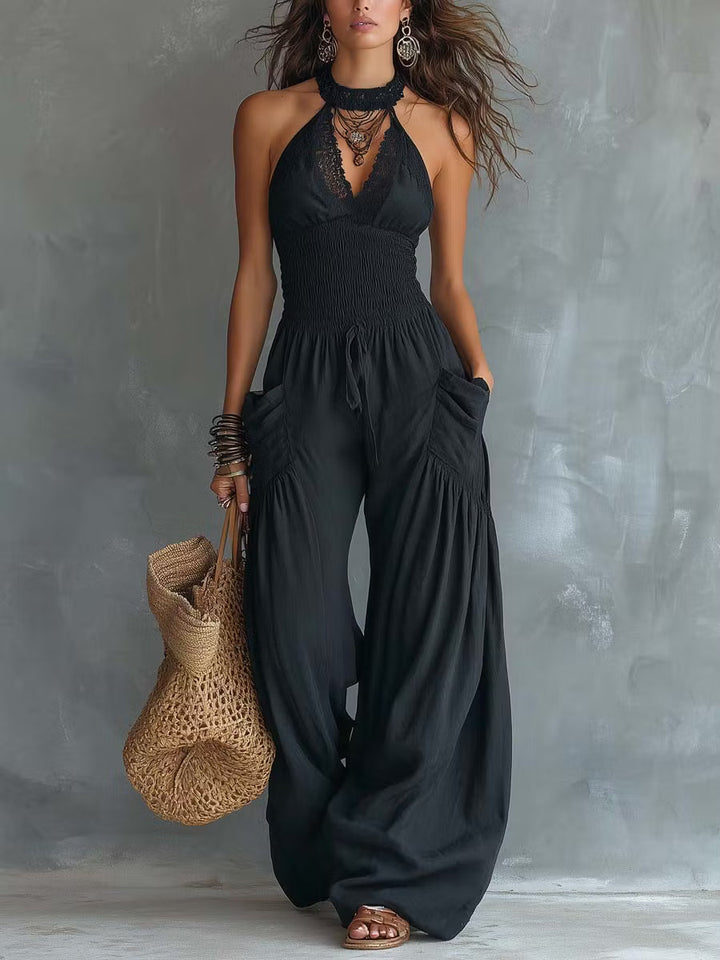 Retro cotton and linen jumpsuit with lace halter neck and pockets.