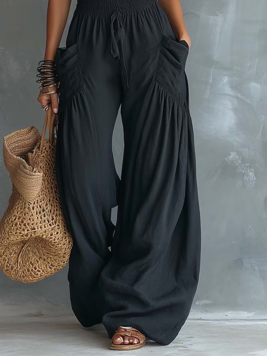Retro cotton and linen jumpsuit with lace halter neck and pockets.