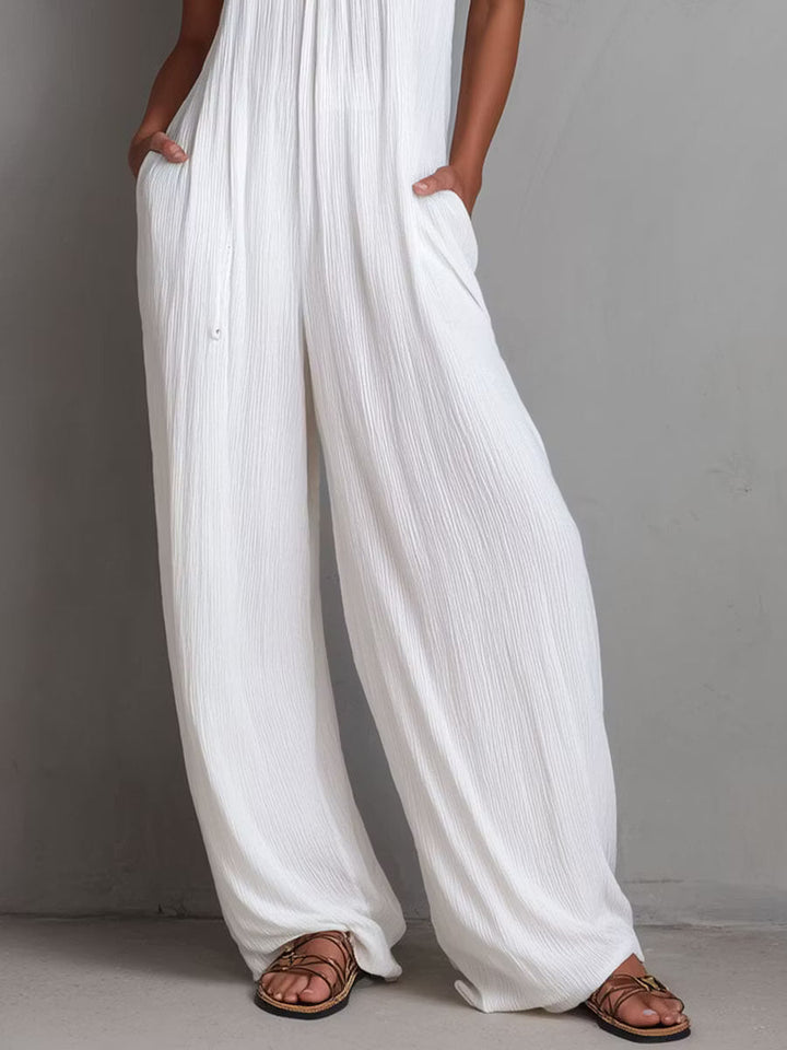 White Pleated Resort Jumpsuit with Halter Neck and Wide Legs