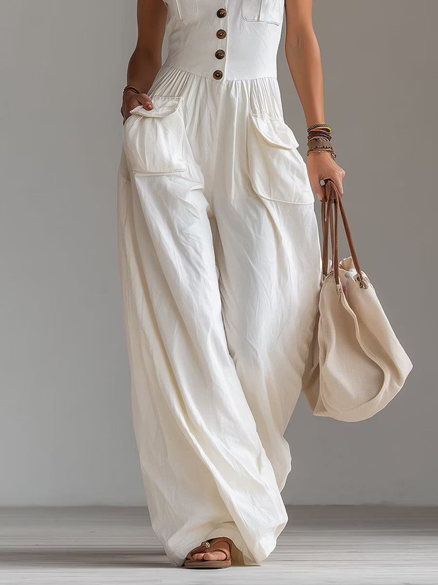 Casual sleeveless wide-leg jumpsuit with applied pockets.